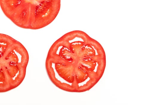slice red ripe tomato isolated top view, fruit and vegetable concept