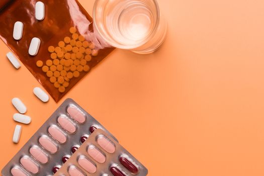 healthcare and medical concept medicine on the orange background with copy space