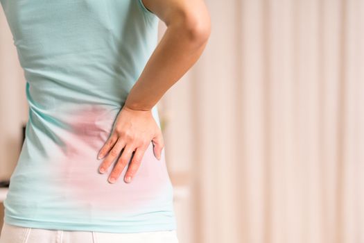 back pain at home. women suffer from backache. healthcare and medical concept