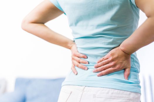 back pain at home. women suffer from backache. healthcare and medical concept