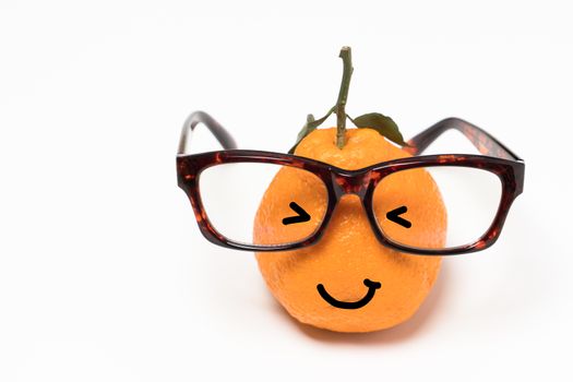 smiley orange wearing the eye glasses on white backgrounds. cartoon emotion face orange isolated