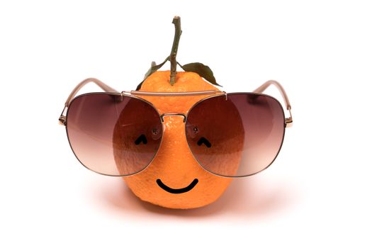 smiley orange wearing the eye glasses on white backgrounds. cartoon emotion face orange isolated