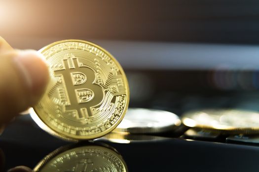 cryptocurrency coins - Litecoin, Bitcoin, Ethereum, Ripple cryptocurrency concept stock of physical bitcoins gold and silver coins