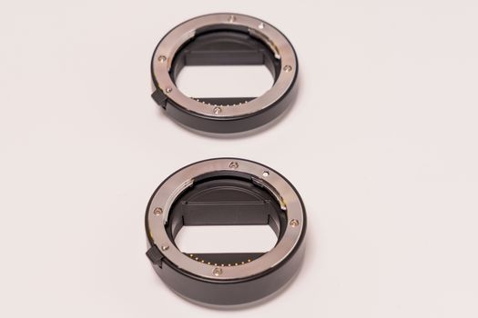 double ring macro extension tube on white background
