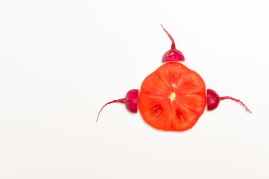 sperm swimming toward to egg concept. crimson giant red radish and red tomato vegetable
