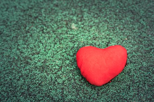 red heart on the green walking path backgrounds with copy space