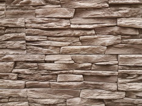 Vintage brown stone wall background texture.