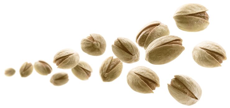 Salted pistachios levitate on a white background.