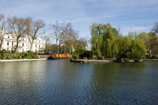View of the part of West London known as Little Venice. The junction where the Grand Union and Regent's Canals meet in Paddington, West London is a high class residential area.