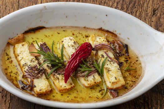grilled feta with herbs in oil
