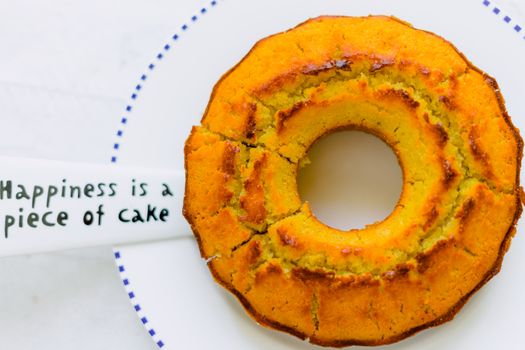 Organic corn cake and white plate on white wooden table