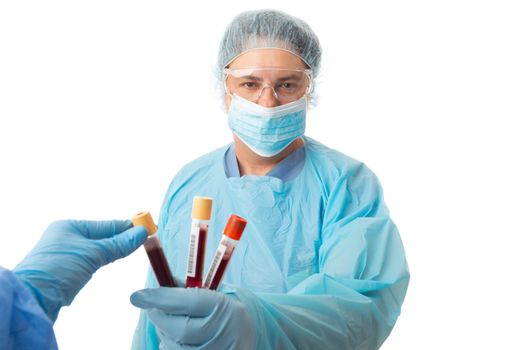 Nurse or doctor holding some patient pathology blood samples for a lab worker to analyse