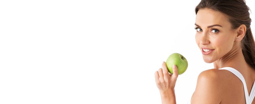 Sexy blonde woman in underwear with apple isolated over white background copy space for text