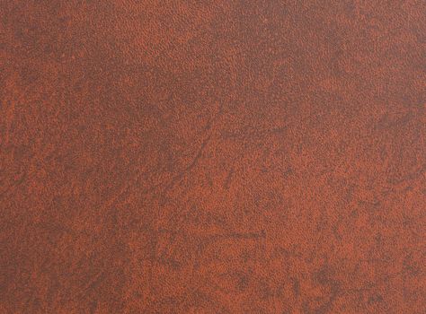 Brown leather book cover used as background.