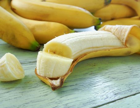 split  bananas placed on a banana peel.