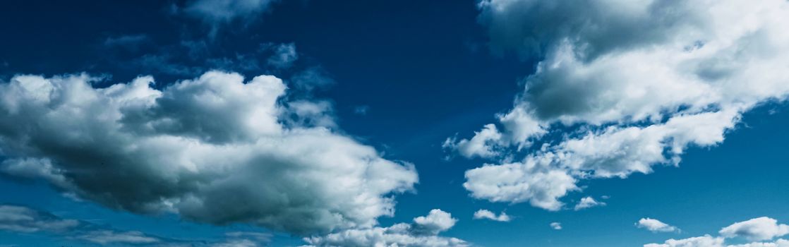 Bright blue sky with clouds, nature and environmental background
