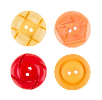 Various sewing button on white background.