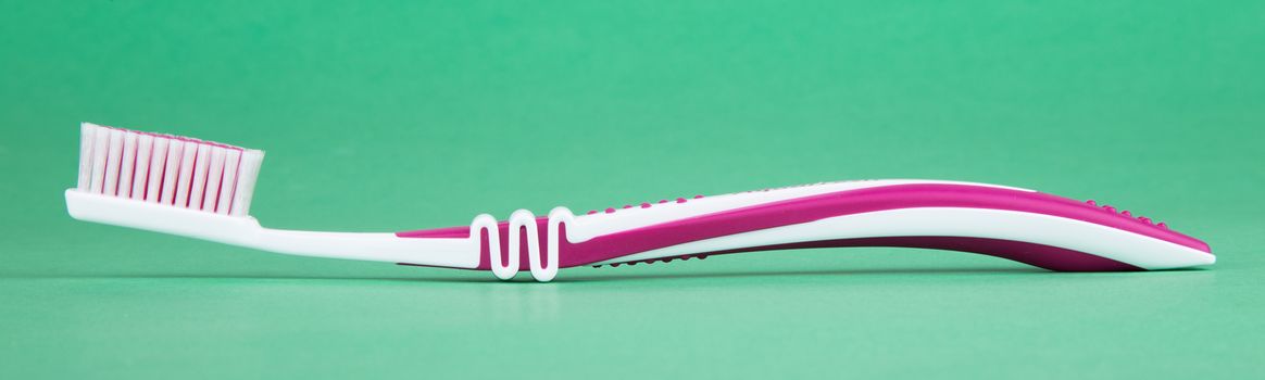 tooth brush isolated on a green background