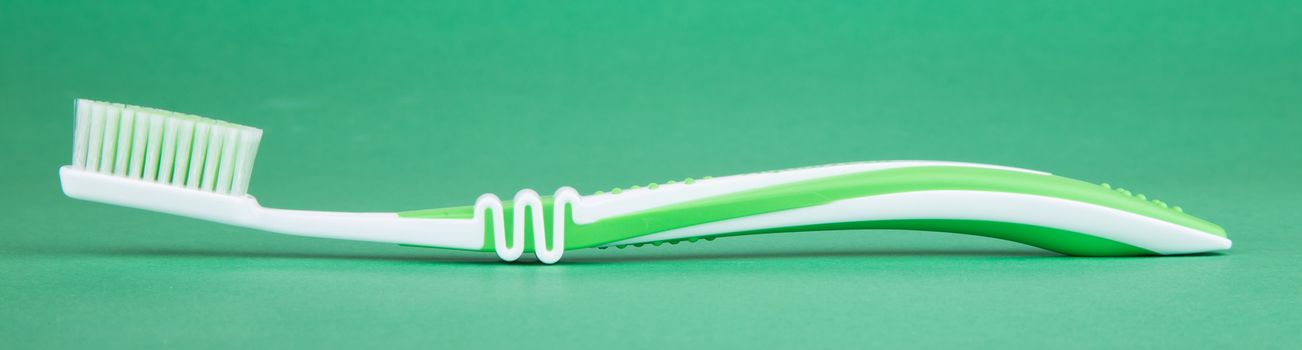 tooth brush isolated on a green background