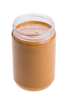 Jar of peanut butter on a white background