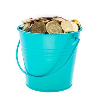 a full bucket of coins on white background