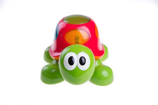 children's toy green turtle isolated on white background
