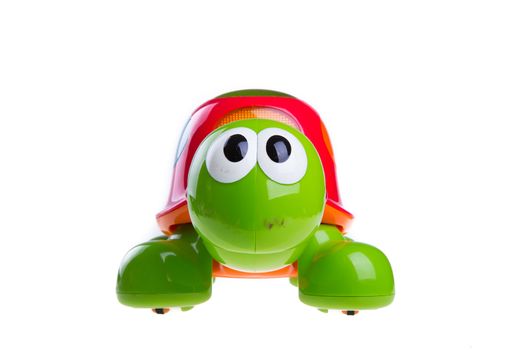 children's toy green turtle isolated on white background