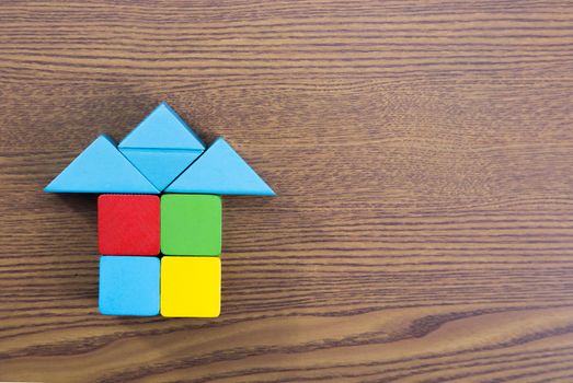 Wooden building blocks-home concept.