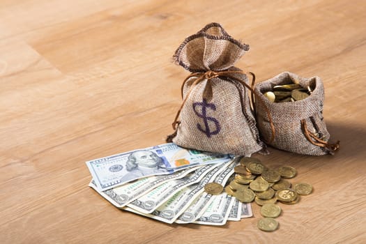 Financial concept. Money and coins on wooden background