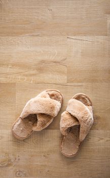 fur sandal on wooden floor background