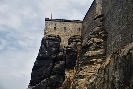 The massive wall of Koenigstein fortress and sandstone rocks