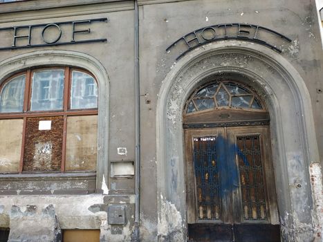 Door, window and facade of abandonned Hotel Goerlitzer Hof in the city center of Goerlitz, Germany