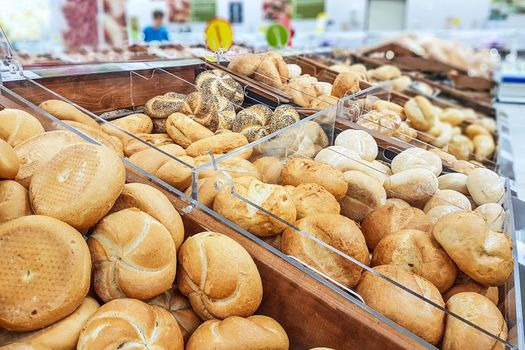 Variety of baked products at a bakery or a supermarket.