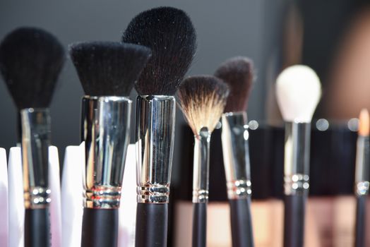 Collection of professional makeup brushes in close-up.