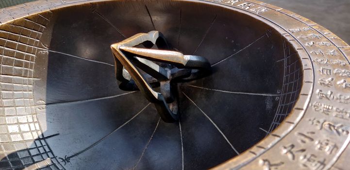 macro shot of the Korean sundial in Gyeongbokgung palace in the Gwanghwamun square in the central of Seoul Capital, this sundial was invented by King Sejong who also devised Korean language, Hangul, as well. This sundial is recreated and displayed at the palace for generations.