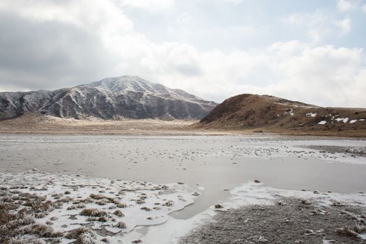 Mount Aso and Kusasenri in winter. covered by golden yellow grassland - Kumamoto, Japan