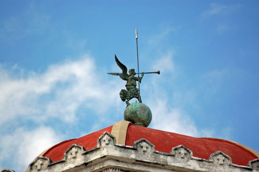 Weathervane in the guise of an angel blowing a trumpet. Roof of the chapel at Havana's Necropolis Cristobal Colon.