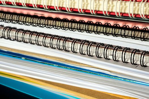 Stacked of office documents paper and notebook in the black background