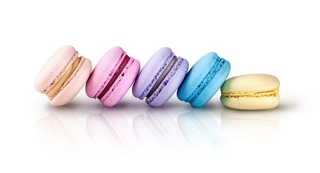 Five multicolored macaroon ladder on a white background