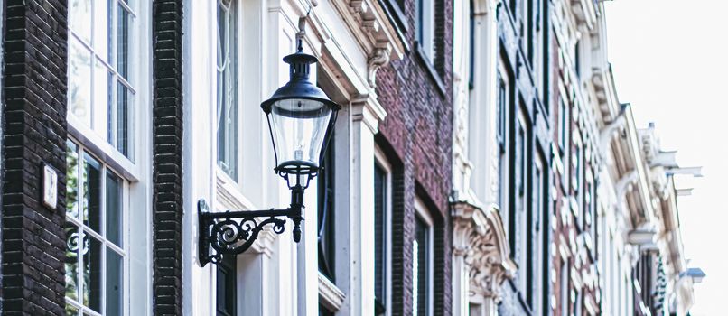 Architectural detail of a building on the main city center street of Amsterdam in Netherlands, european architecture