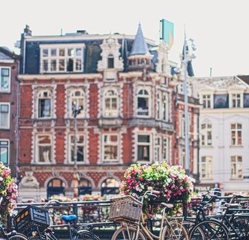 Main downtown street in the city center of Amsterdam in Netherlands on sunny day