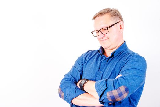 Smiling middle aged men in glasses and  blue shirt