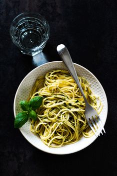 Cooked tasty spaghetti pasta in a bowl, top view