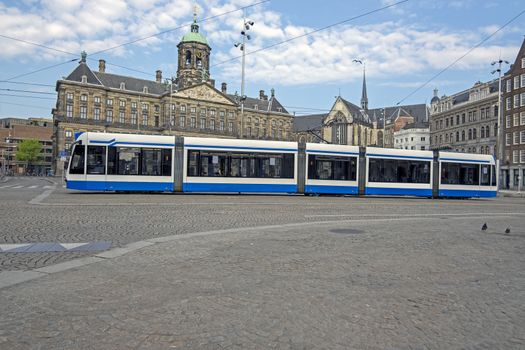 City scenic from Amsterdam at the Dam Square with the Royal Palace in the Netherlands