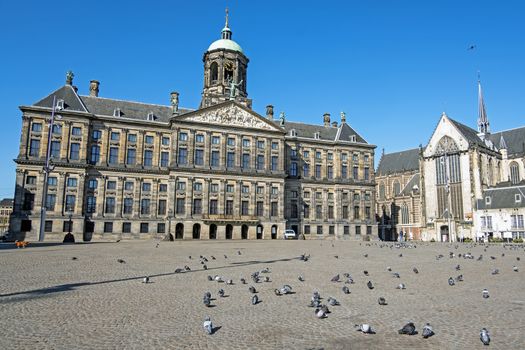 City scenic from Amsterdam at the Dam Square with the Royal Palace in the Netherlands