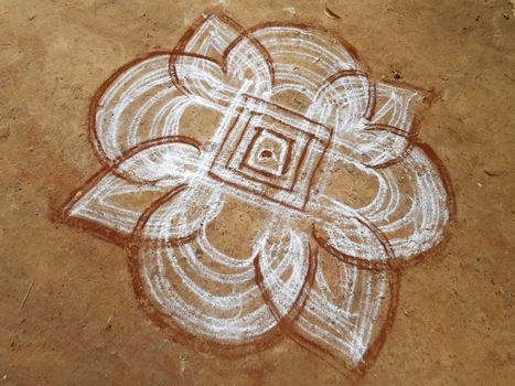 Painting in the sand in the streets from Tiruvanamalai in India Asia