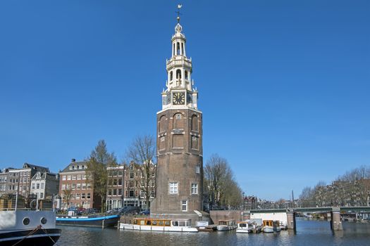 City scenic from Amsterdam in the Netherlands with the Montelbaan tower