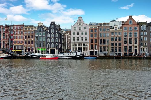 Medieval houses along the river Amstel in Amsterdam Netherlands