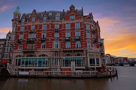 Medieval building along the river Amstel in Amsterdam Netherlands