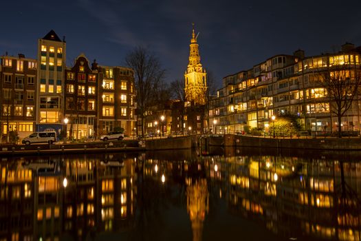 City scenic from Amsterdam with the Zuiderkerk in the Netherlands at night